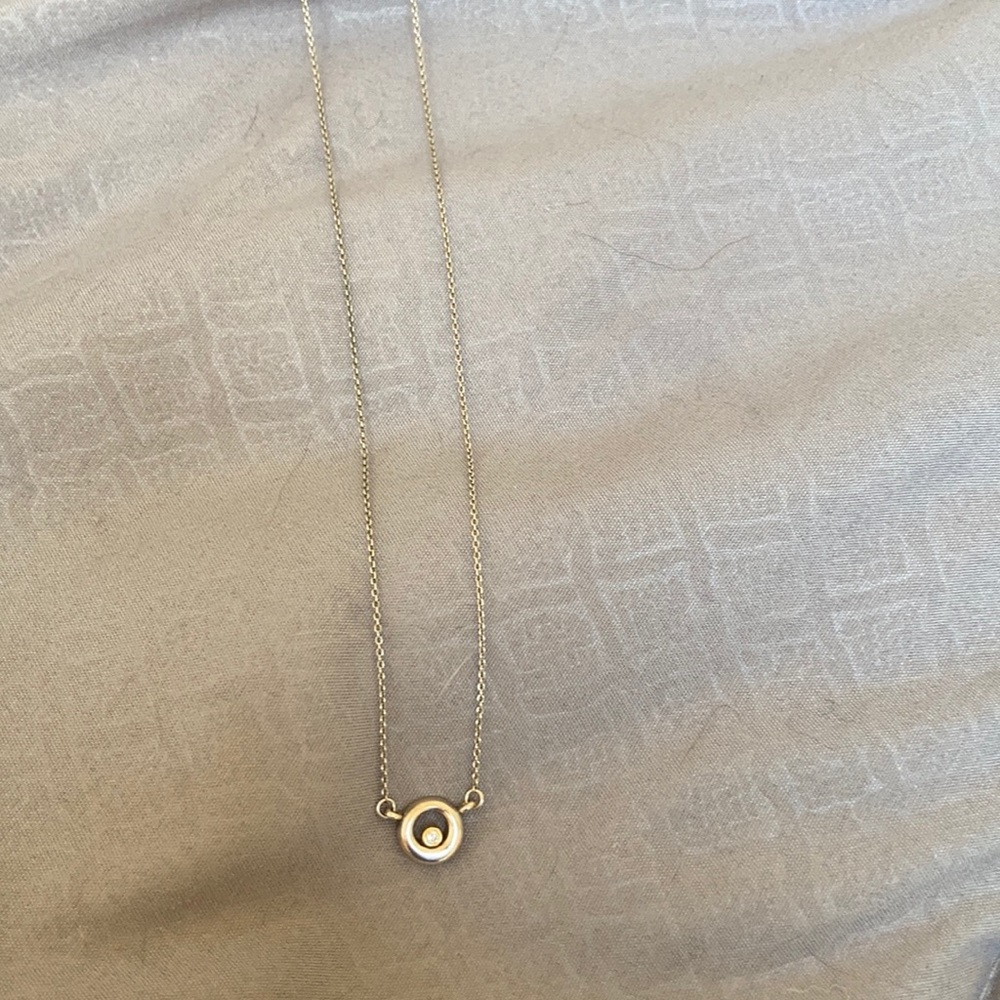 Movado silver small single diamond necklace